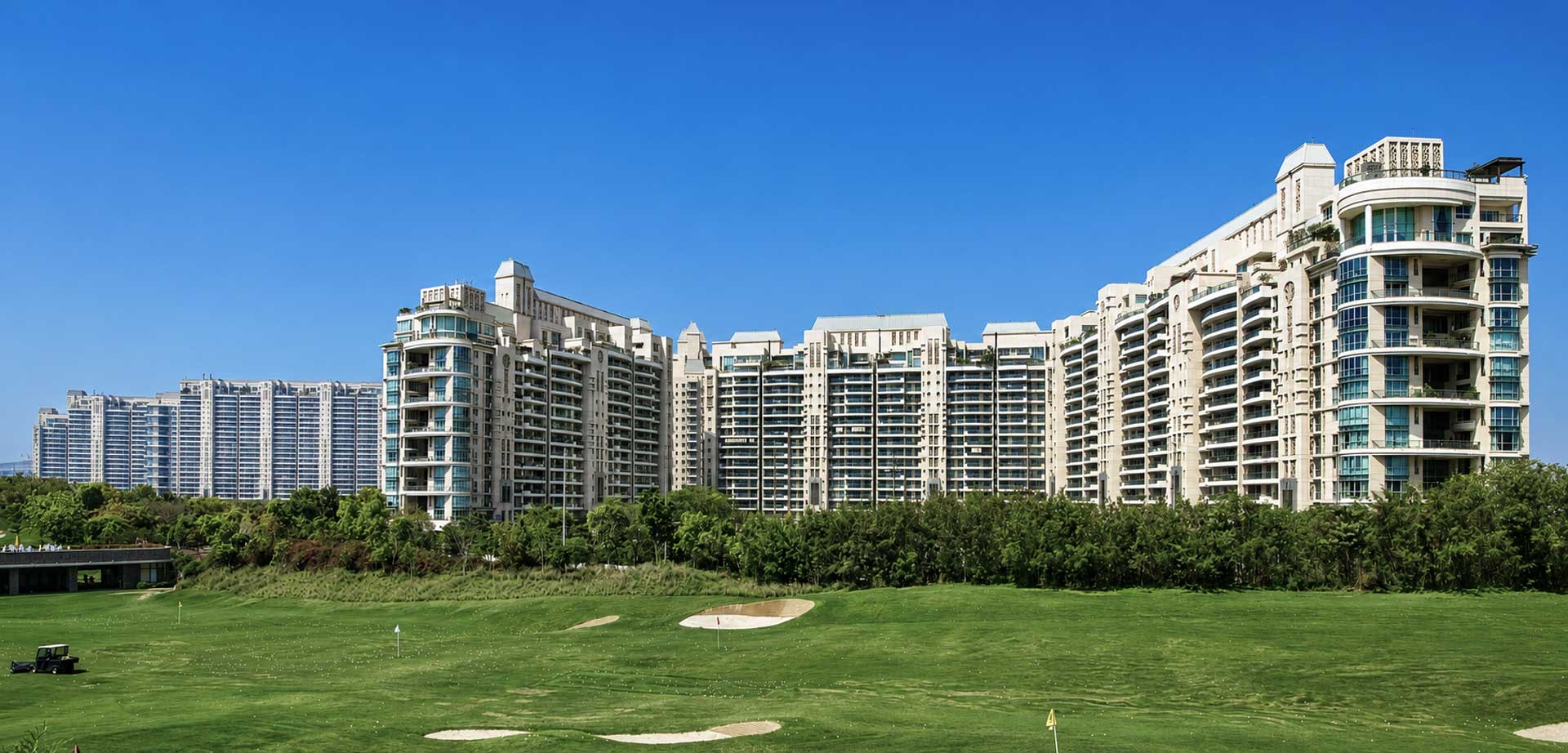Classical cream towers of The Aralias on Golf Course Road, a completed resale address in Gurugram