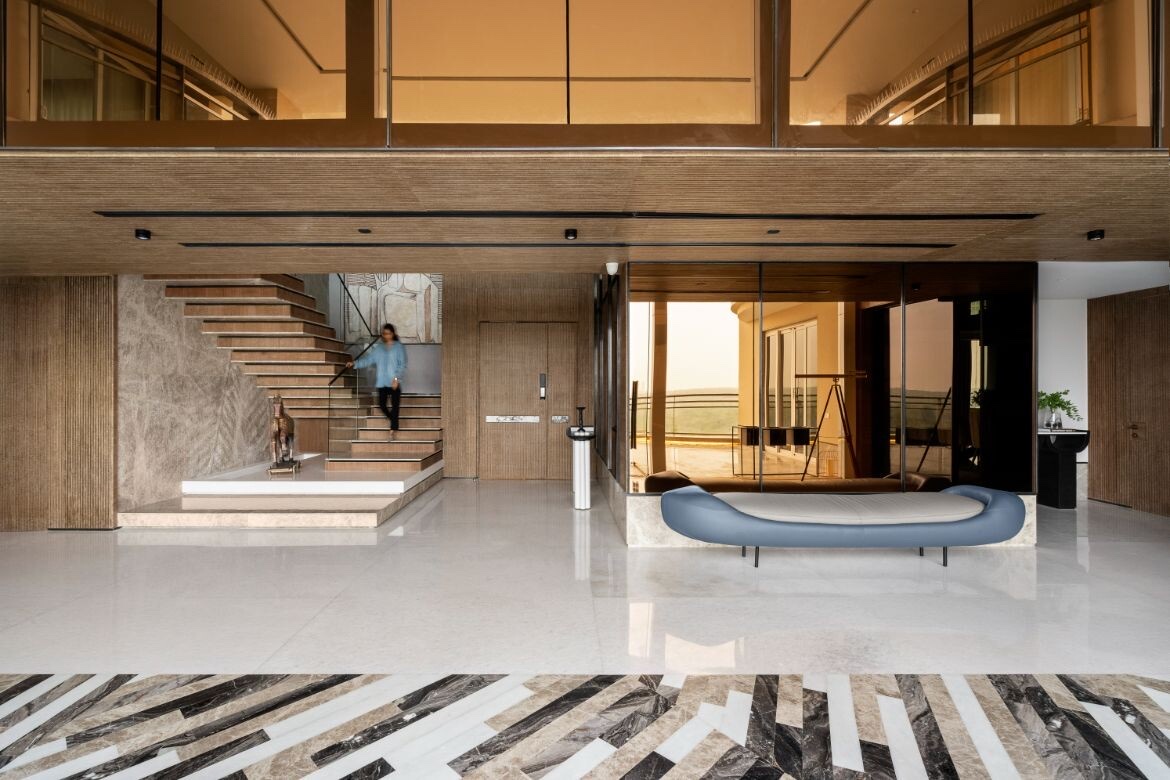 Double-height foyer and sculptural stair