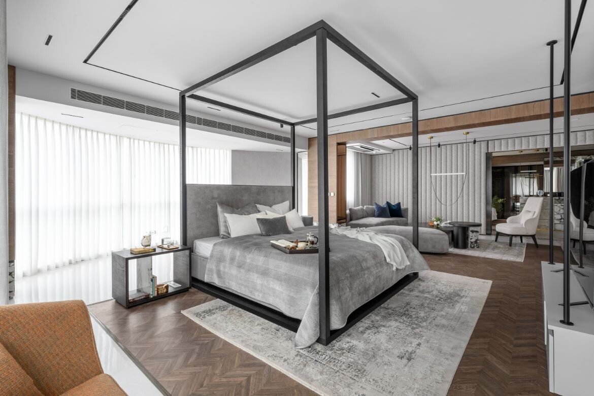 Bedroom with a slender four-poster frame