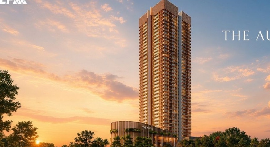 The Aureva tower against a sunset sky