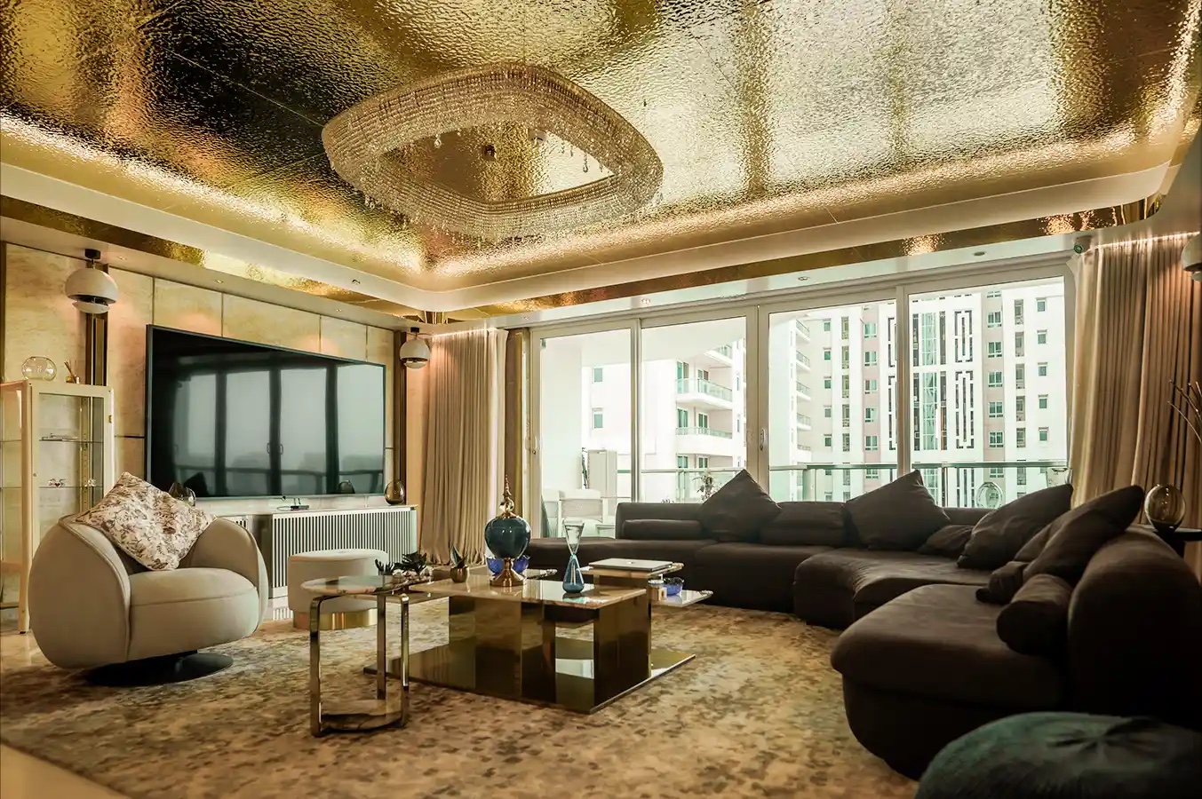 Living room beneath a sculpted ceiling