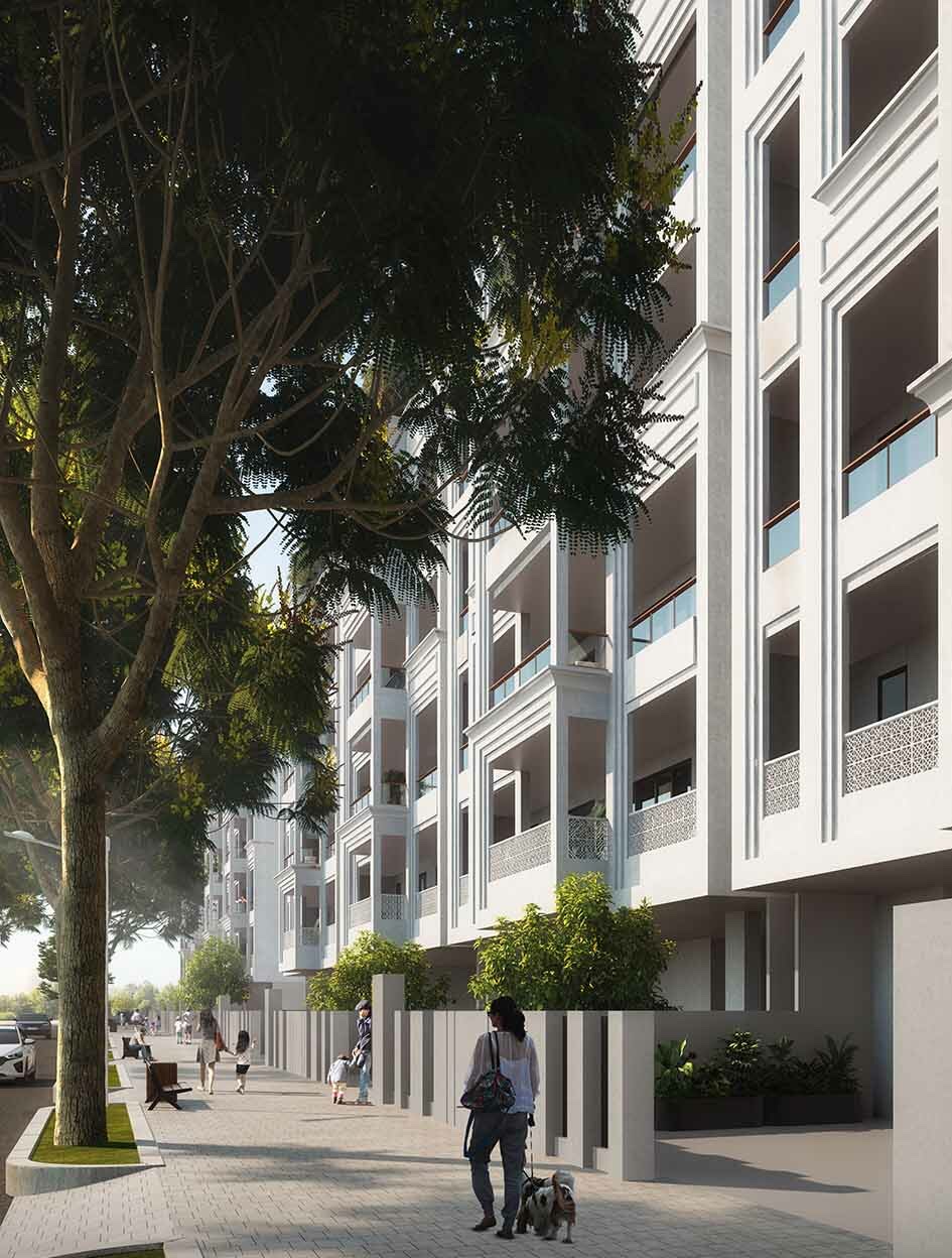 Low-rise facade with louvres along a shaded boulevard