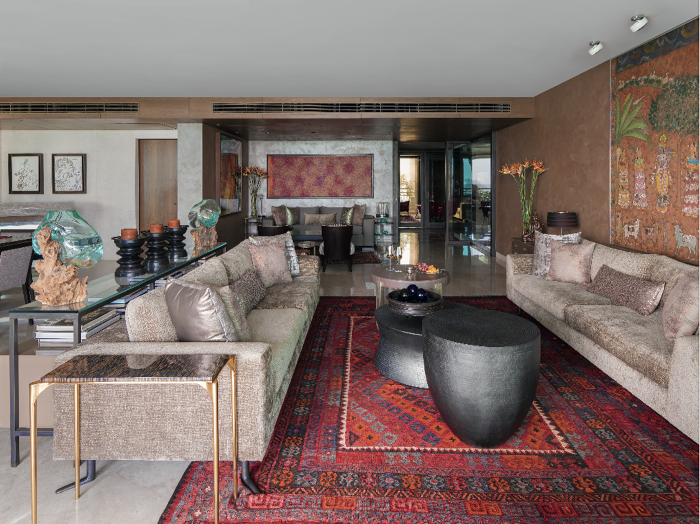 Living room with Pichwai artwork and kilim
