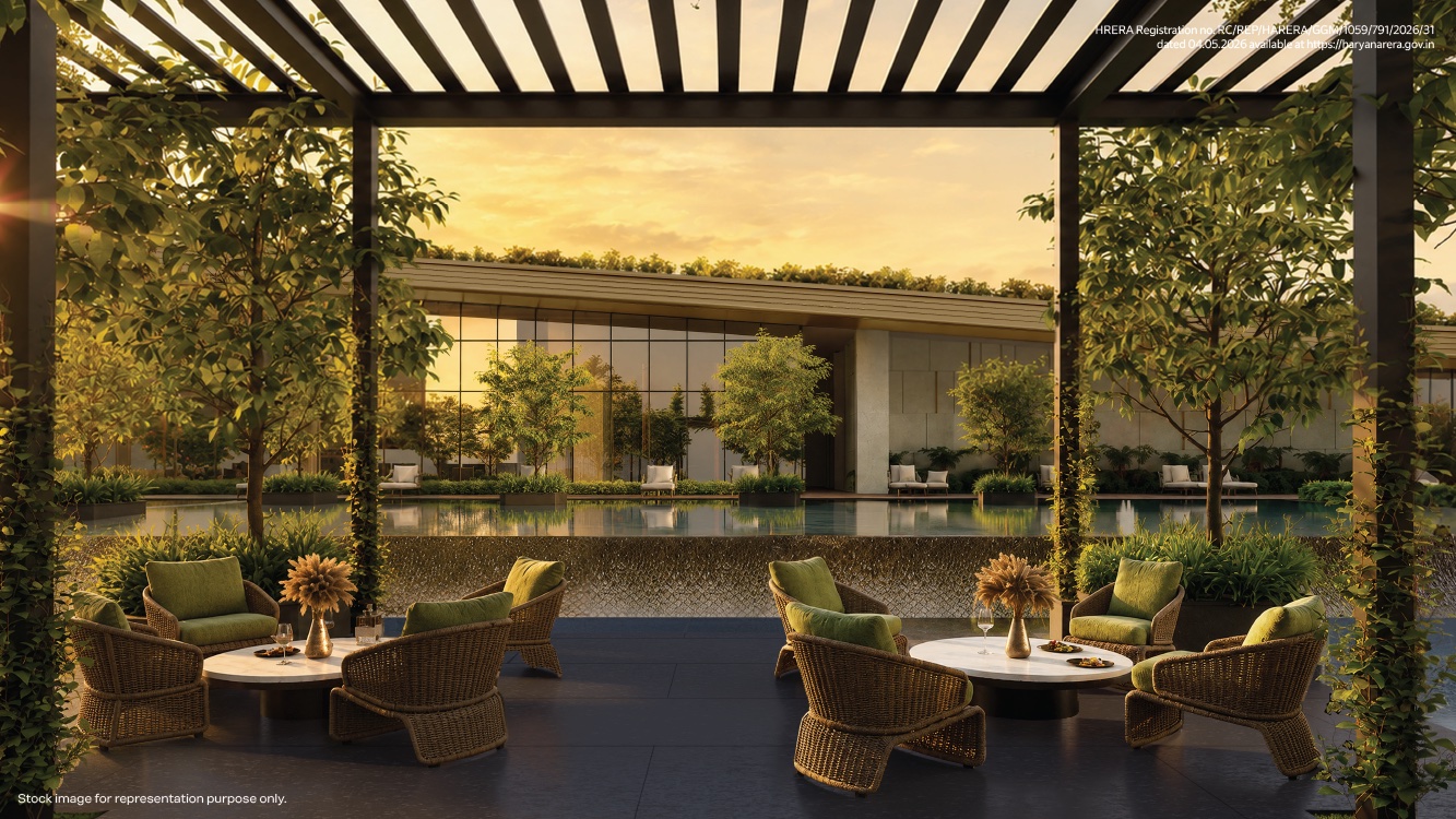 Pergola lounge overlooking a reflecting pool at dusk