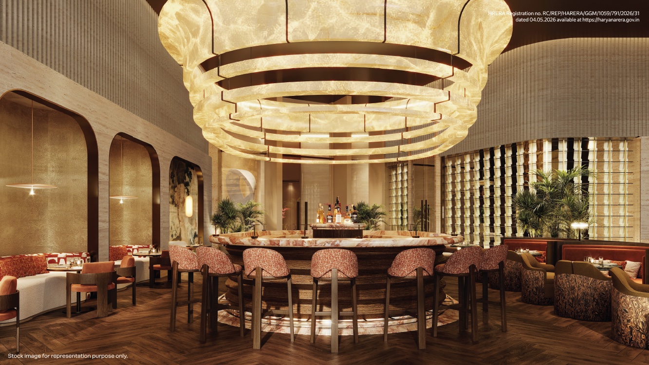 Clubhouse dining room beneath a sculptural chandelier