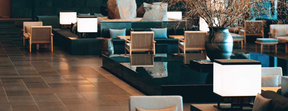 Outdoor lounge with lantern lighting (representative mood image)