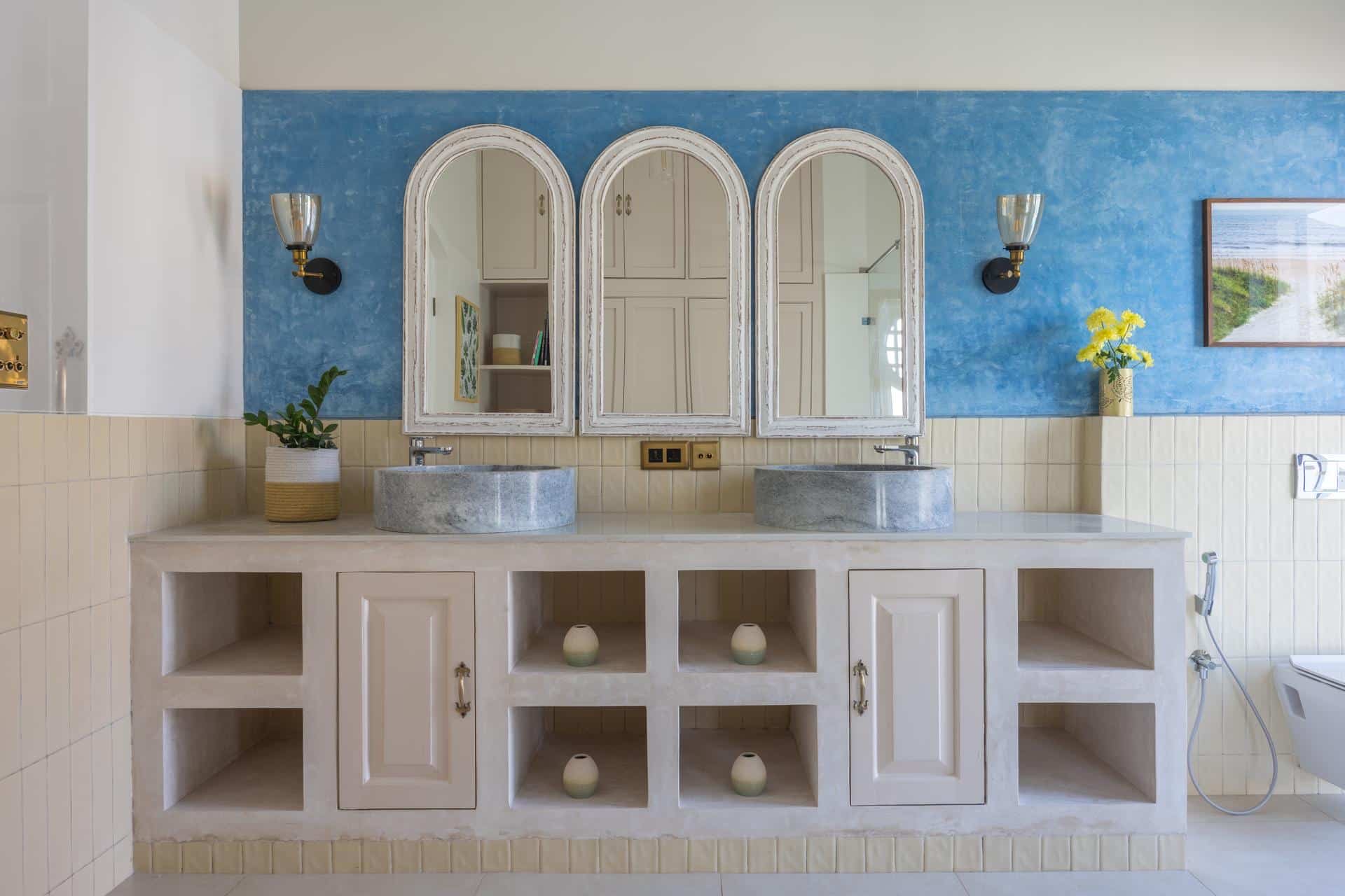 Bathroom with arched mirrors and limewash wall (Isprava Villa Sobreda)