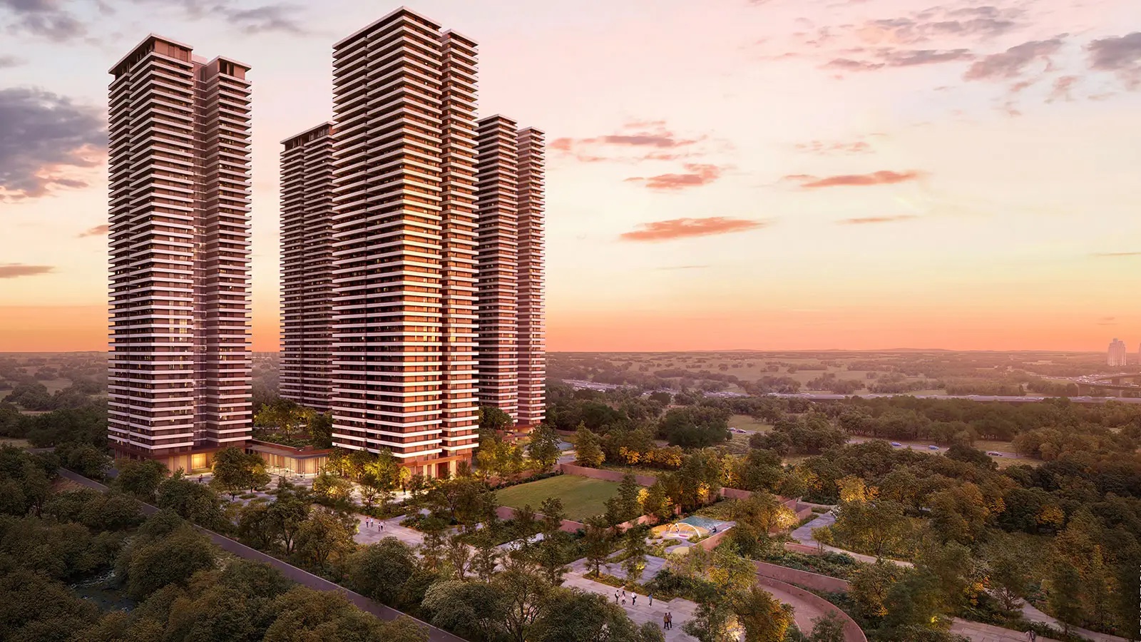 Estate 361 towers above a forested landscape at sunset