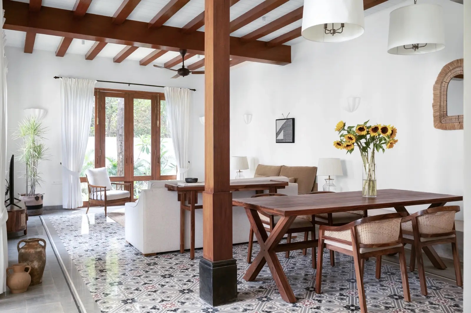 Timber-beamed living and dining room with patterned tiles (La Branca, representative)