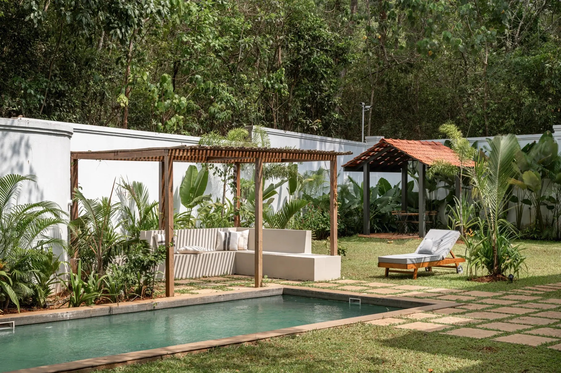 Pool and pergola lounge in a walled garden (La Branca, representative)