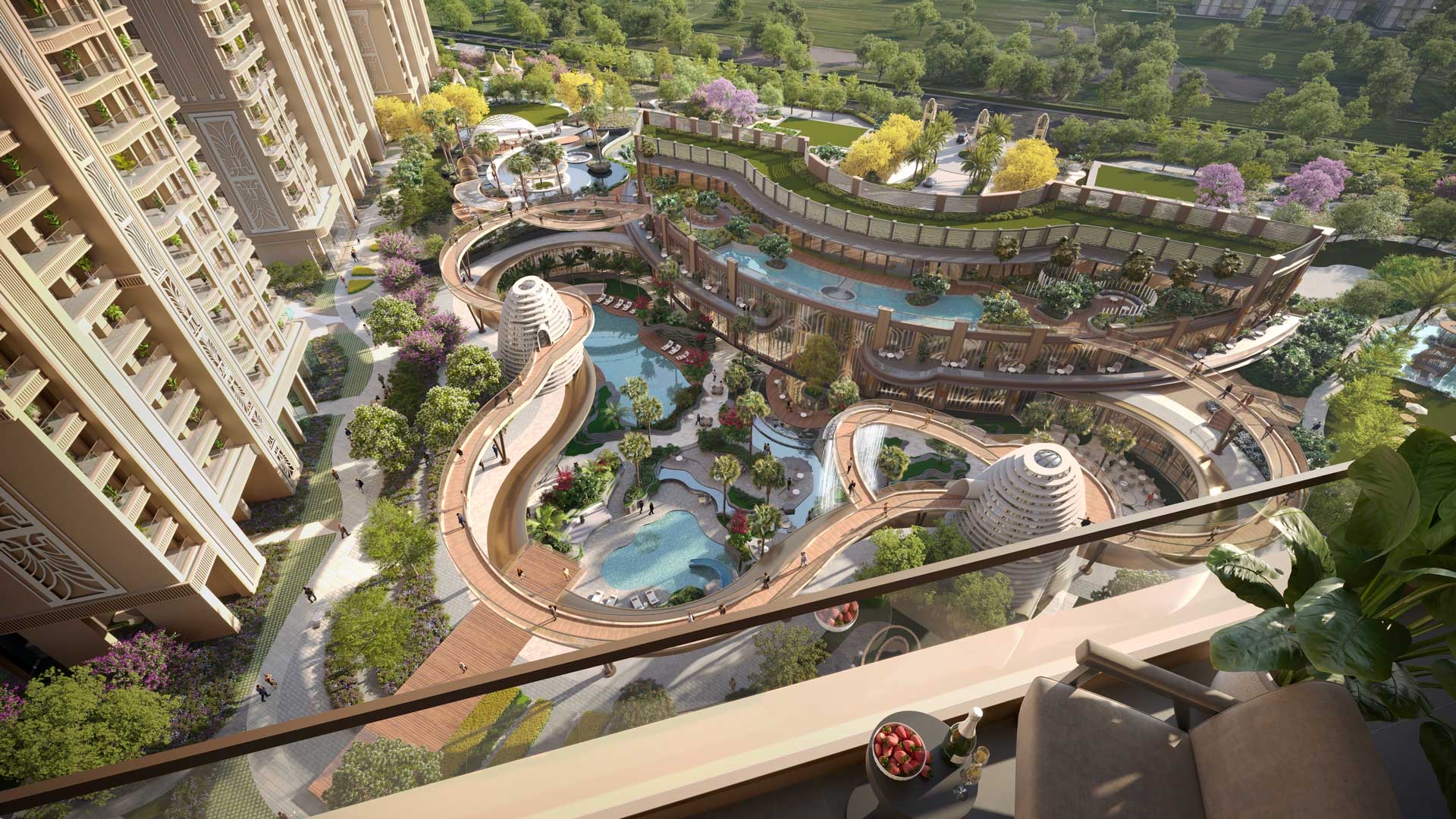 Elevated landscape and pools seen from a residence balcony